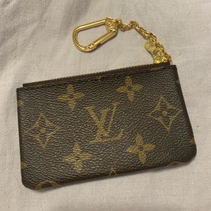 Selling a designer inspired coin purse with a clip.
